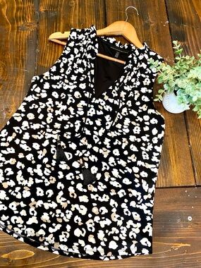 White House black market leopard print sleeveless ruffle v neck tassle blouse